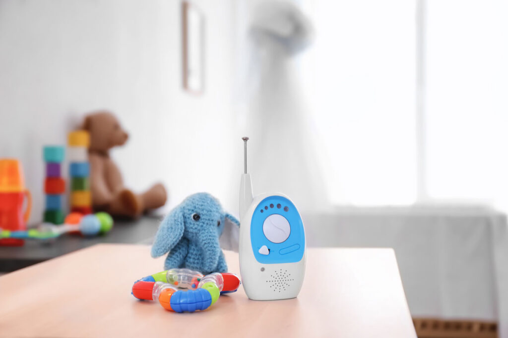 baby monitor for travel on table with two baby toys.