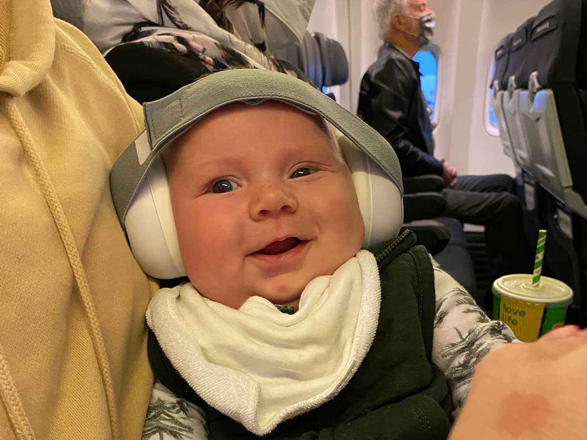 baby wearing airplane headphones.