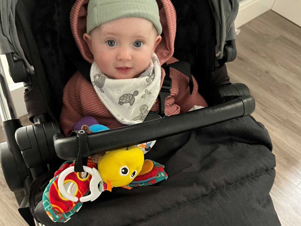 using baby buddy secure-a-toy straps on stroller.