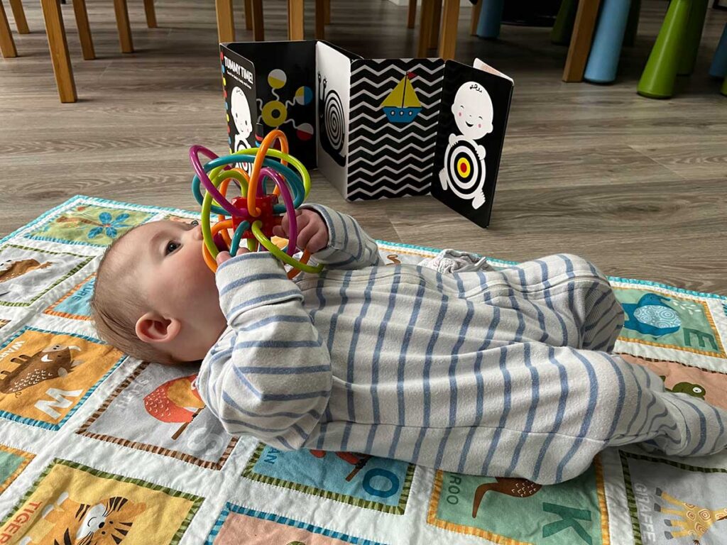 baby playing with baby travel toys.