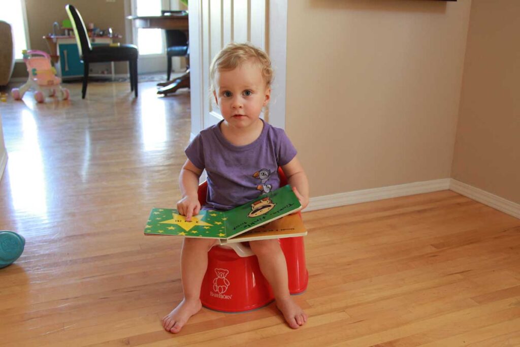 toddler on babybjorn toddler potty.