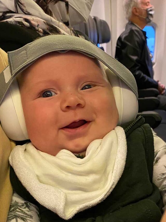 baby wearing airplane headphones.