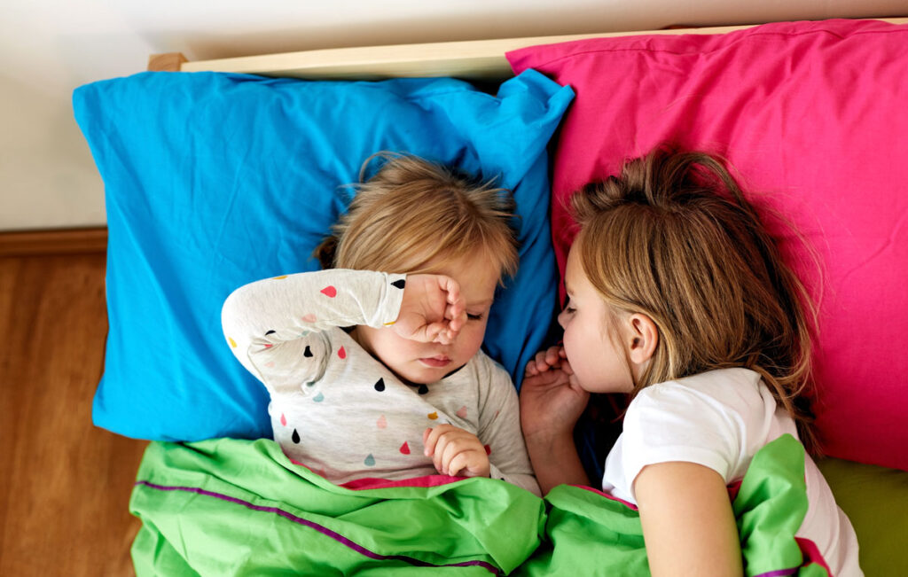 toddlers sharing a bed