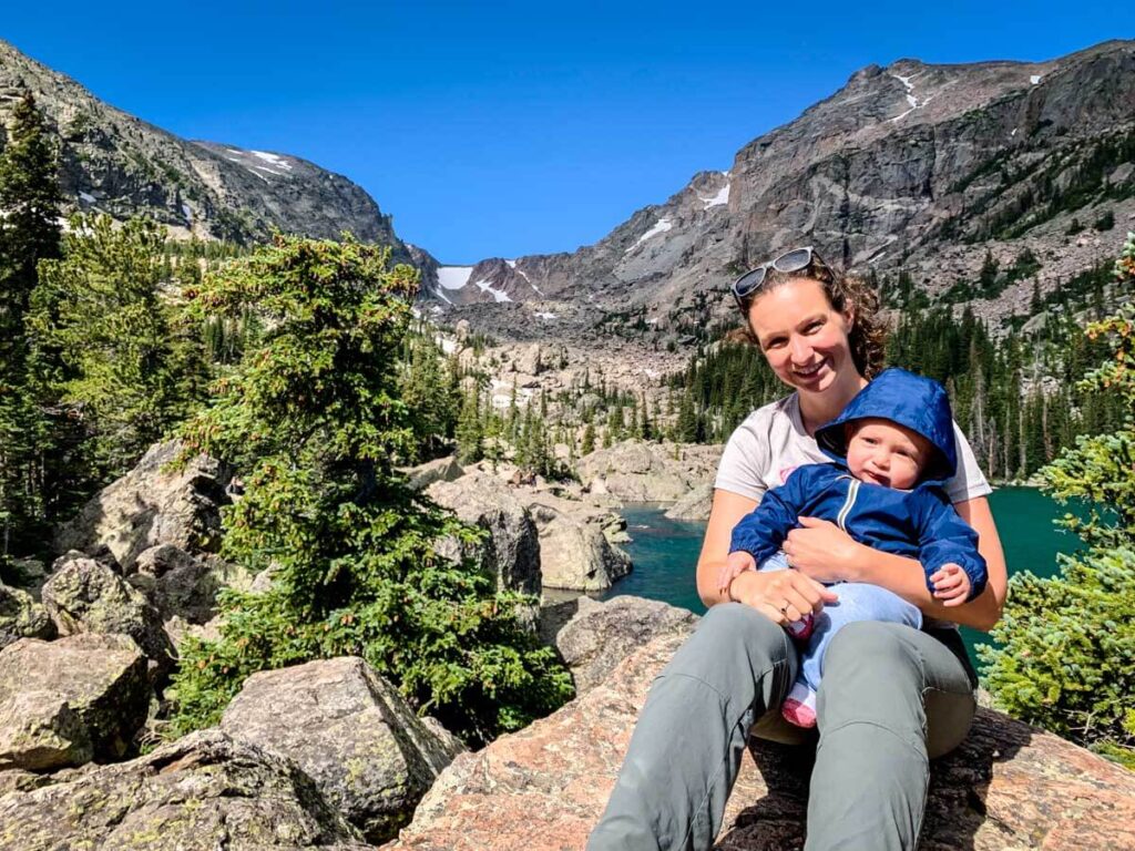 Mom holding baby on Bear Lake Hike - Rocky Mountain NP Hikes with a baby