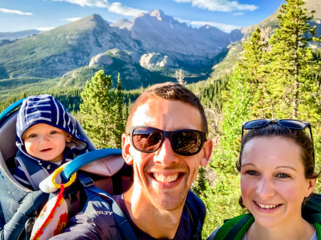 parents with baby in hiking backpack carrier on Bear Lake Hike in Rocky Mountain NP