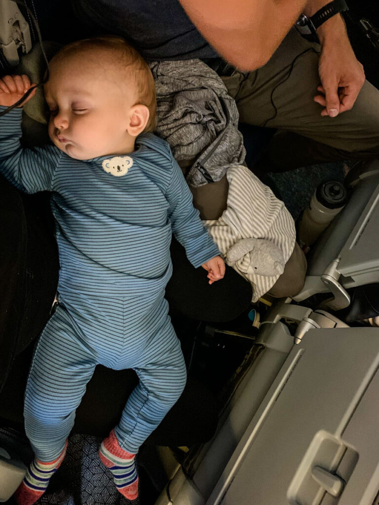 baby sleeping on plane