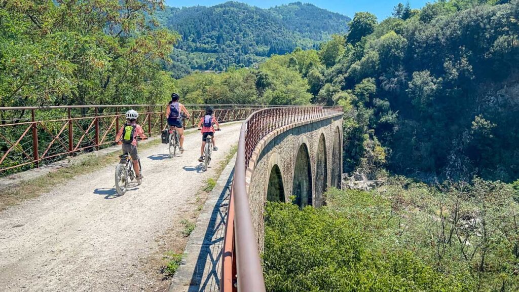 a family who loves to travel enjoys a cycling trip along La Dolce Via in France