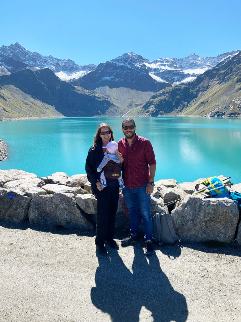 a family hiking to Finstertaler Stausee in Kühtai while visiting Austria with a Baby.