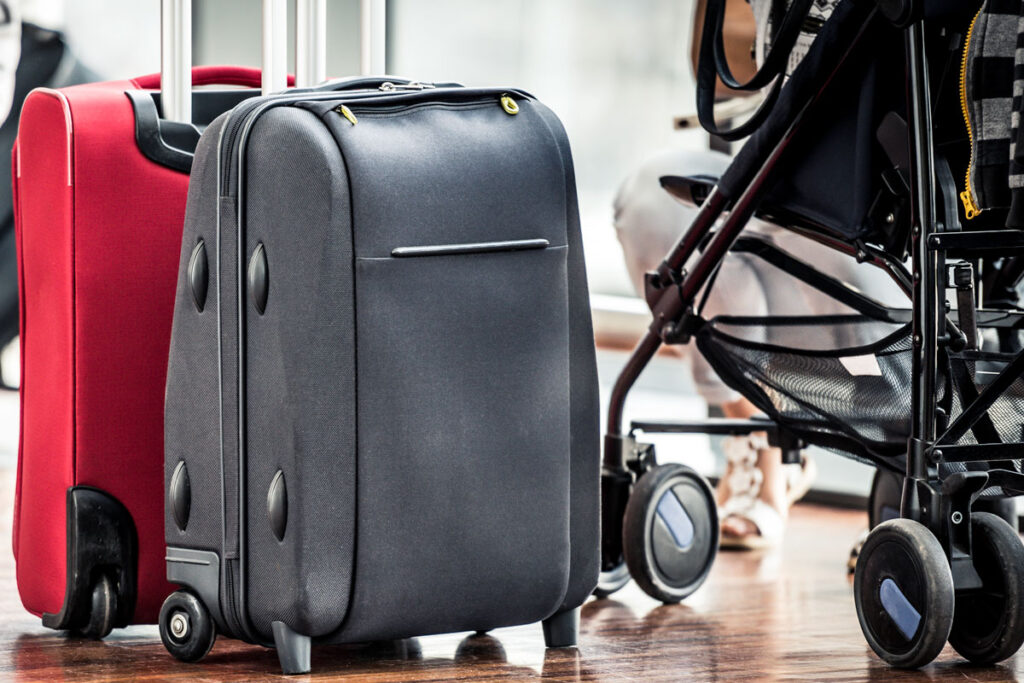 luggage next to stroller at airport