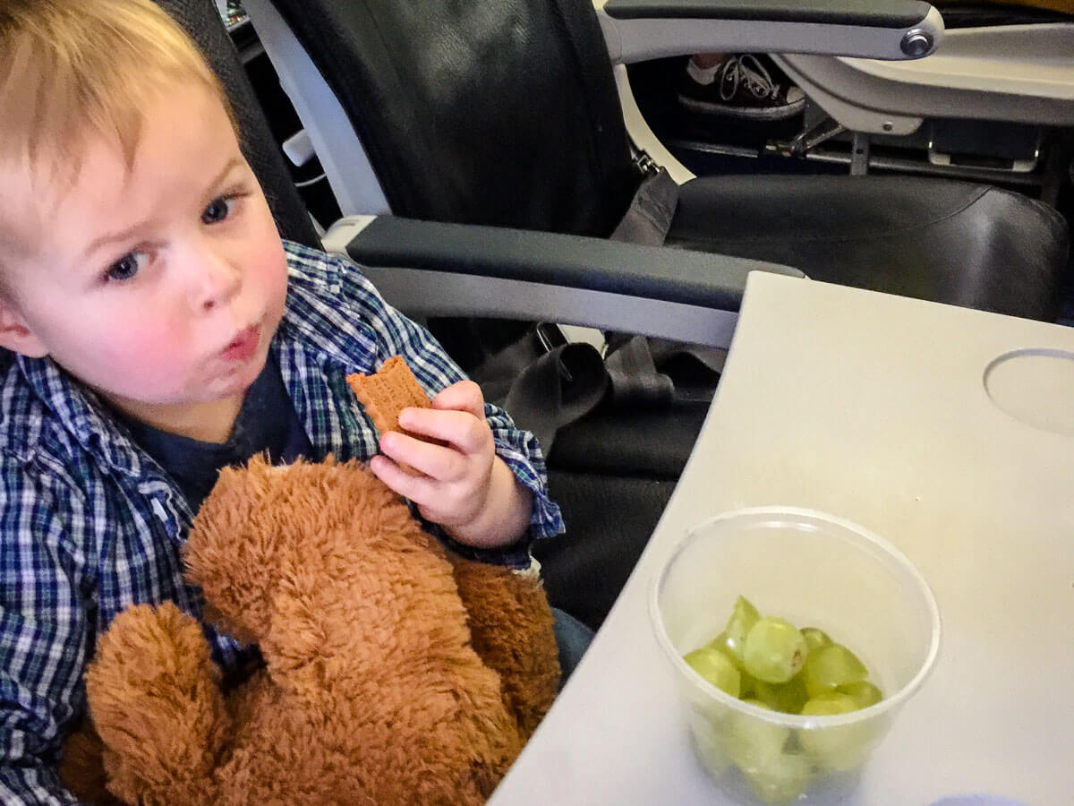 toddler eating airplane snacks for toddlers