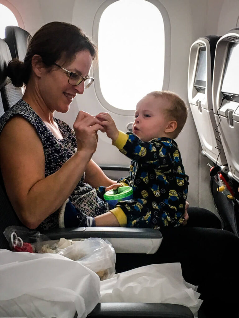 mother and toddler on airplane