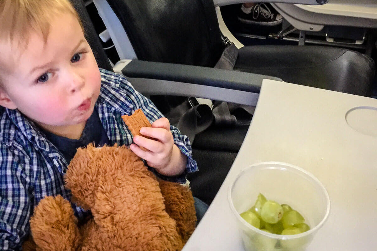 toddler eating airplane snacks for toddlers