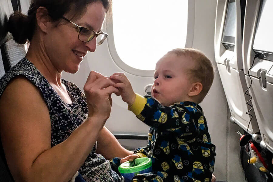 mother and toddler on airplane