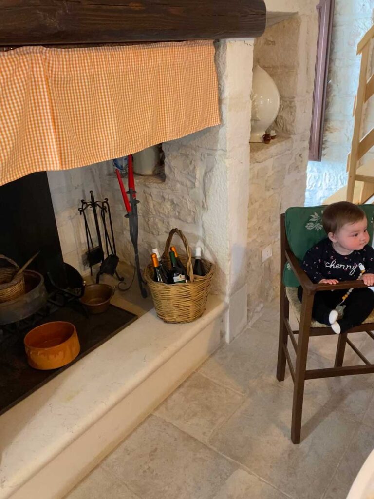 baby in highchair in Trullo Isabella - Puglia Italy