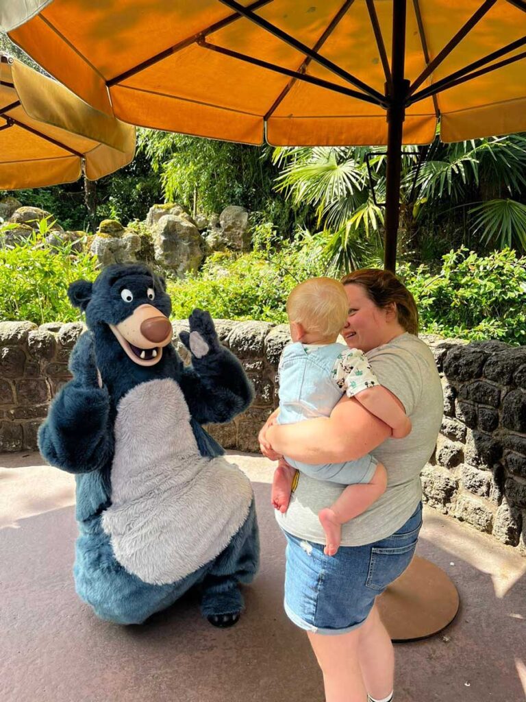 Mom holding baby at Disneyland Paris