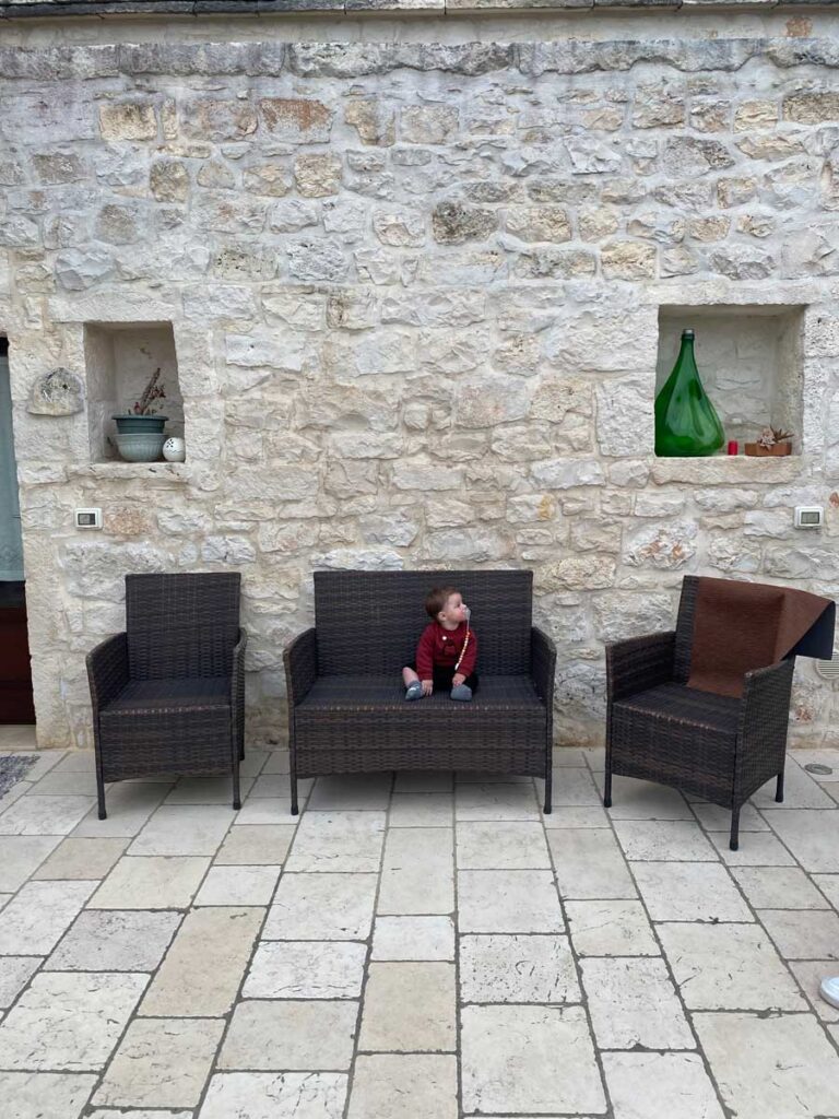 Baby on couch at Trullo Isabella - where to stay in Puglia with baby