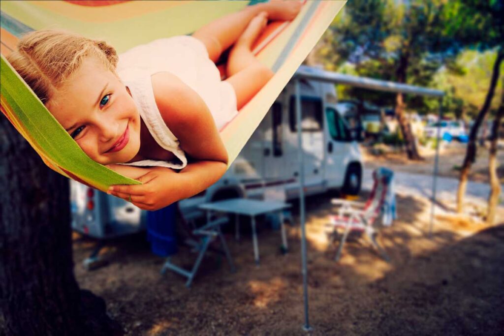 child in hammock - best toddler camping activity