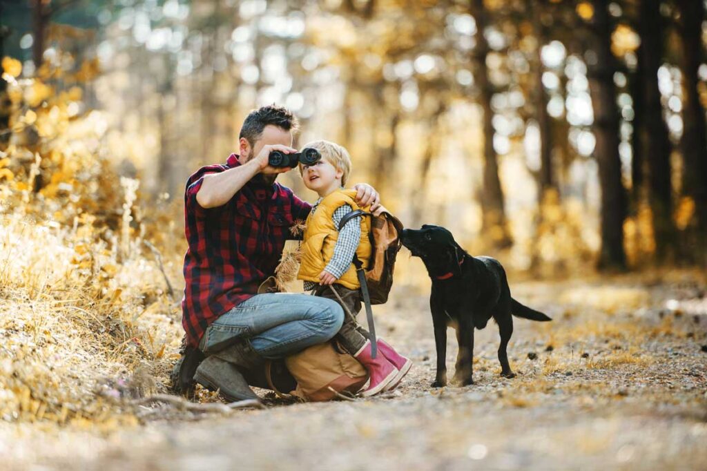 toddler and father bird watching - perfect camping activity for toddlers