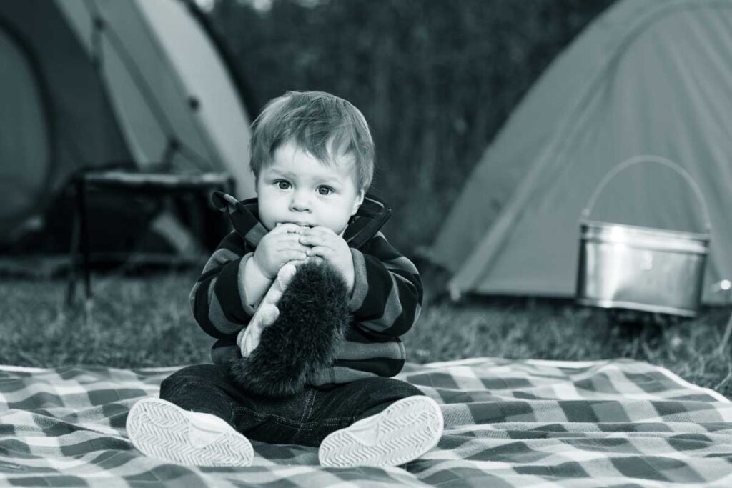 toddler on blanket - camping with toddler