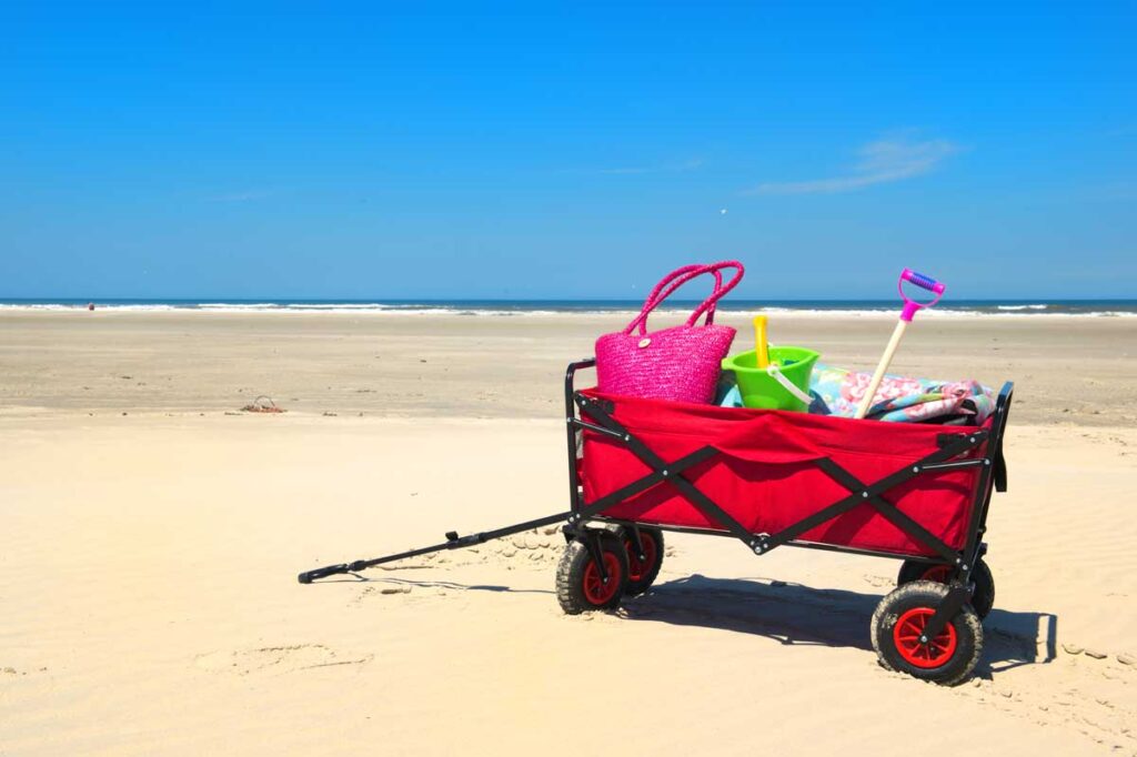 wagon on sand - easy way to take baby beach essentials to beach