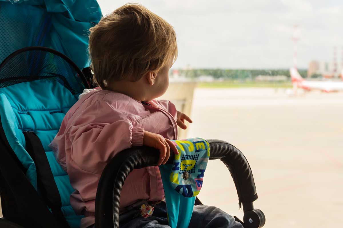 baby in stroller in airport