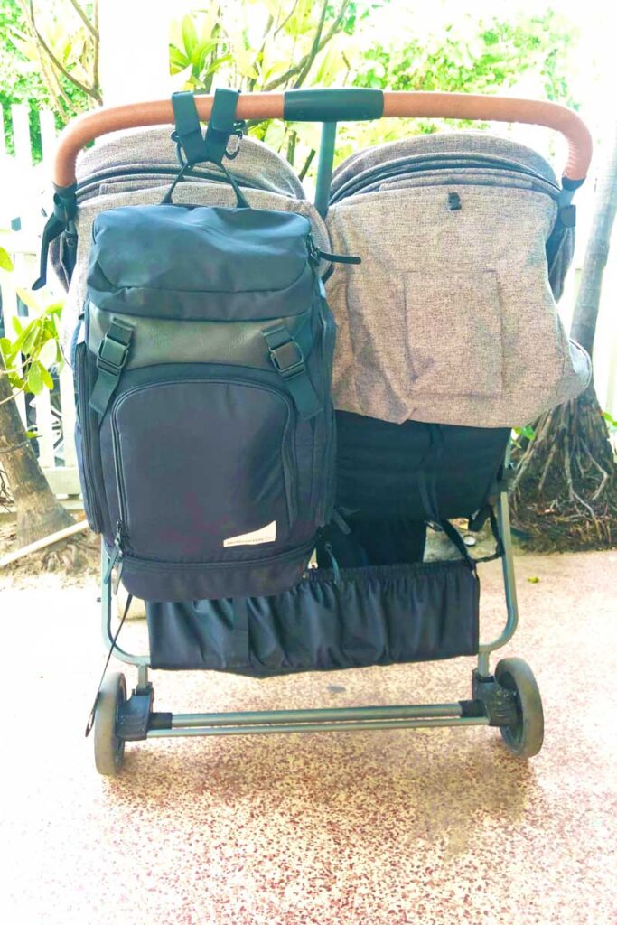 No Reception Club Getaway Bag hanging on the back of a double travel stroller