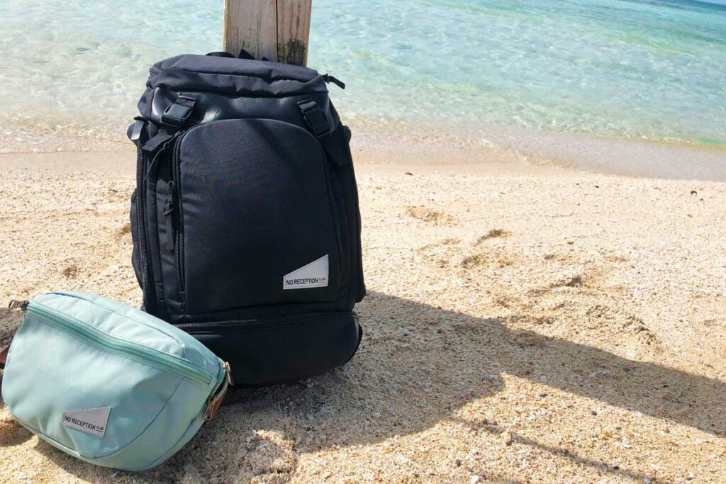 No Reception Club Getaway Bag and Sidekick on beach