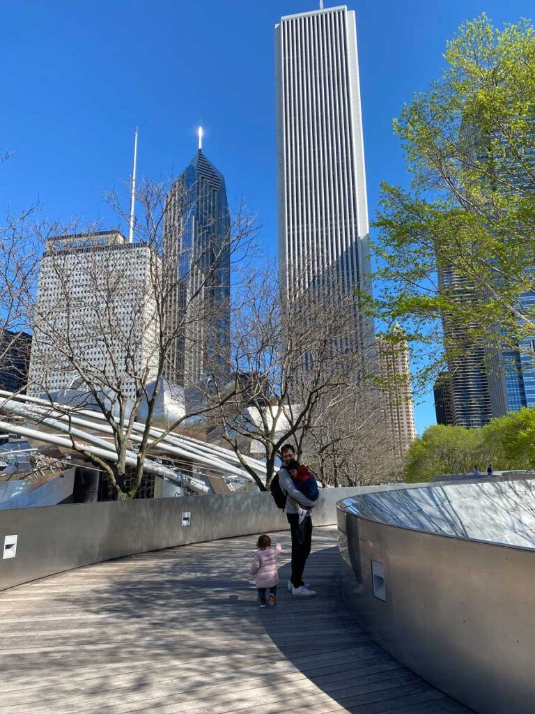 father and two toddlers in Chicago on BP Pedestrian Bridge