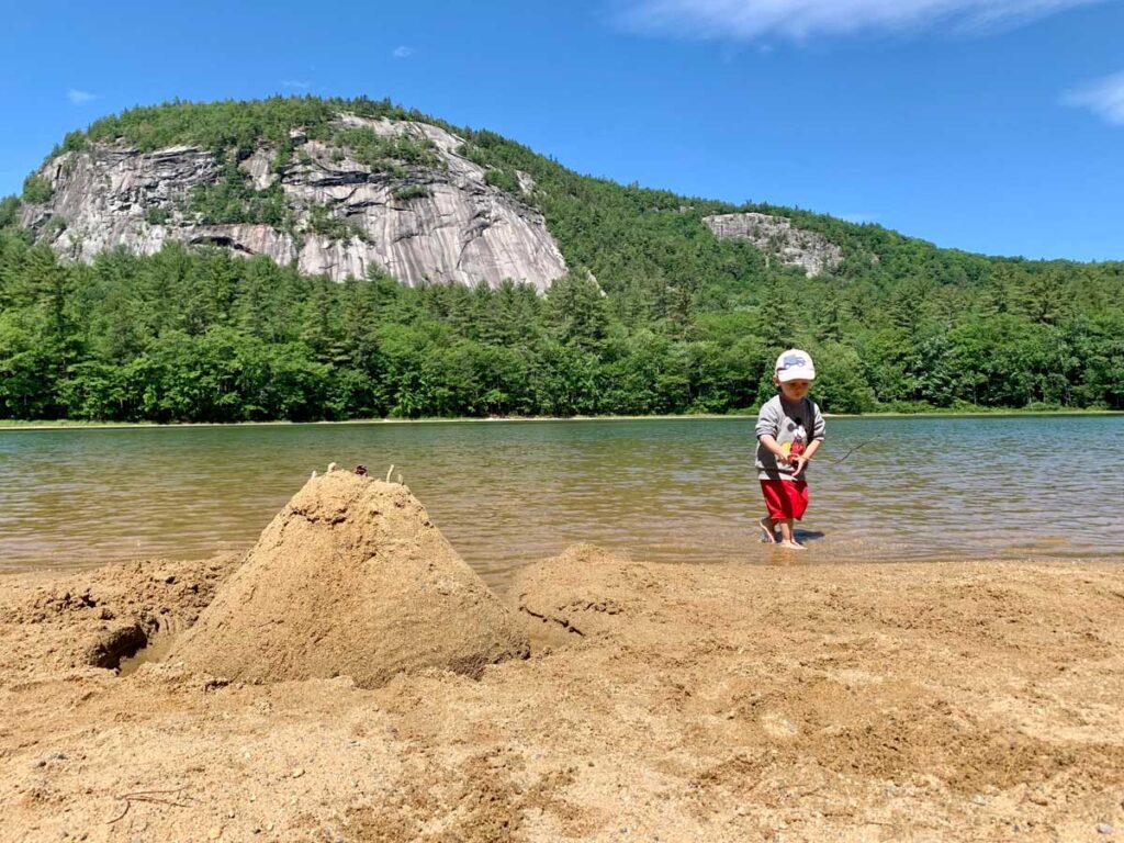 toddler playing in water at Echo Lake State Park - one of the best things to do with toddlers in North Conway