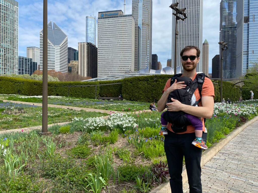 Father with baby in baby carrier in Chicago