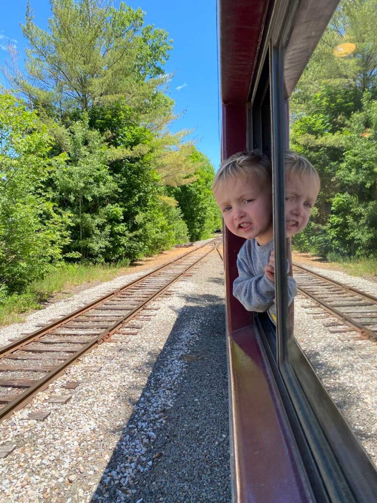 toddler at window on Conway Scenic Railroad