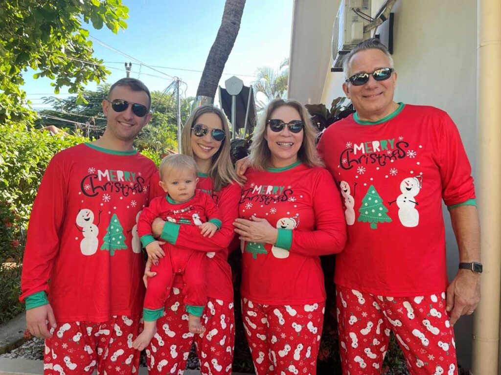 family wearing matching christmas pajamas in Costa Rica with a baby