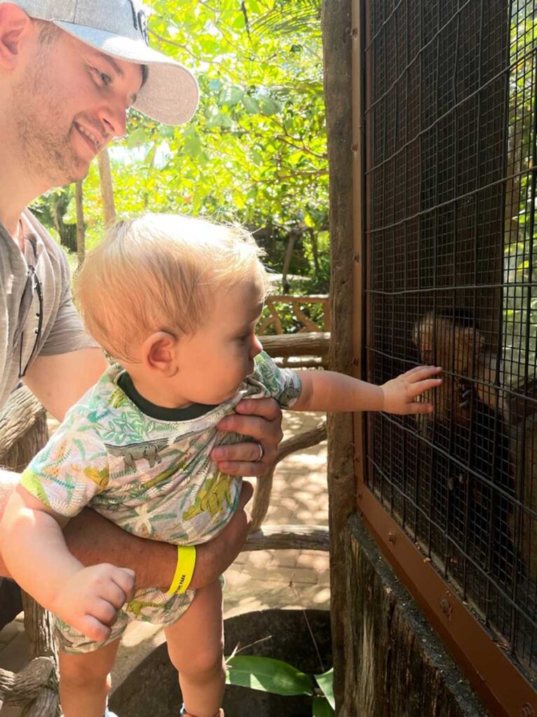 father holding baby at Diamante Eco Adventure Park in Costa Rica