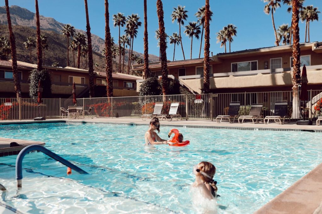 family playing in pool - best things to do with toddlers in Palm Springs