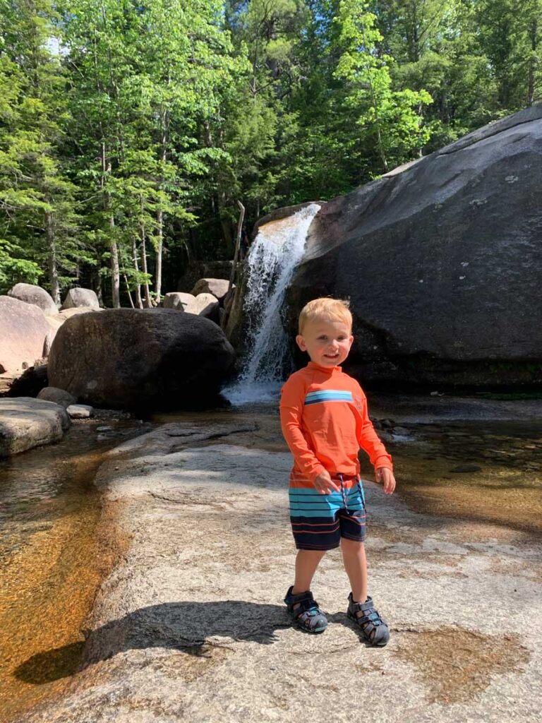 Toddler standing near water at Diana's Bath - White Mountains