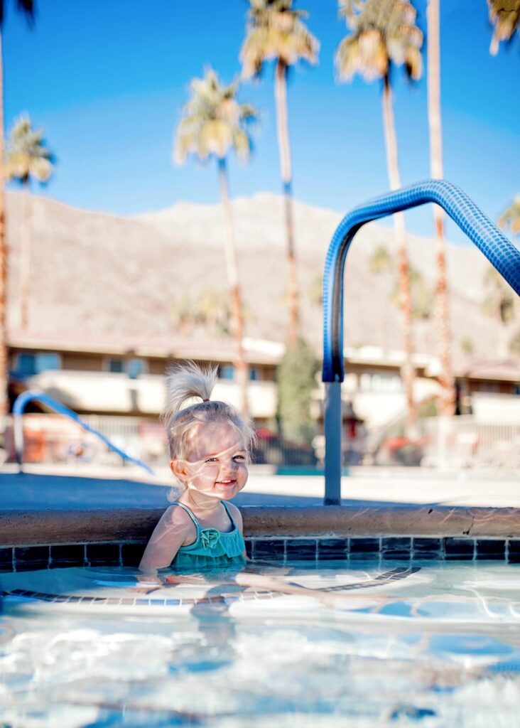 toddler in pool at vacation rental in Palm Springs