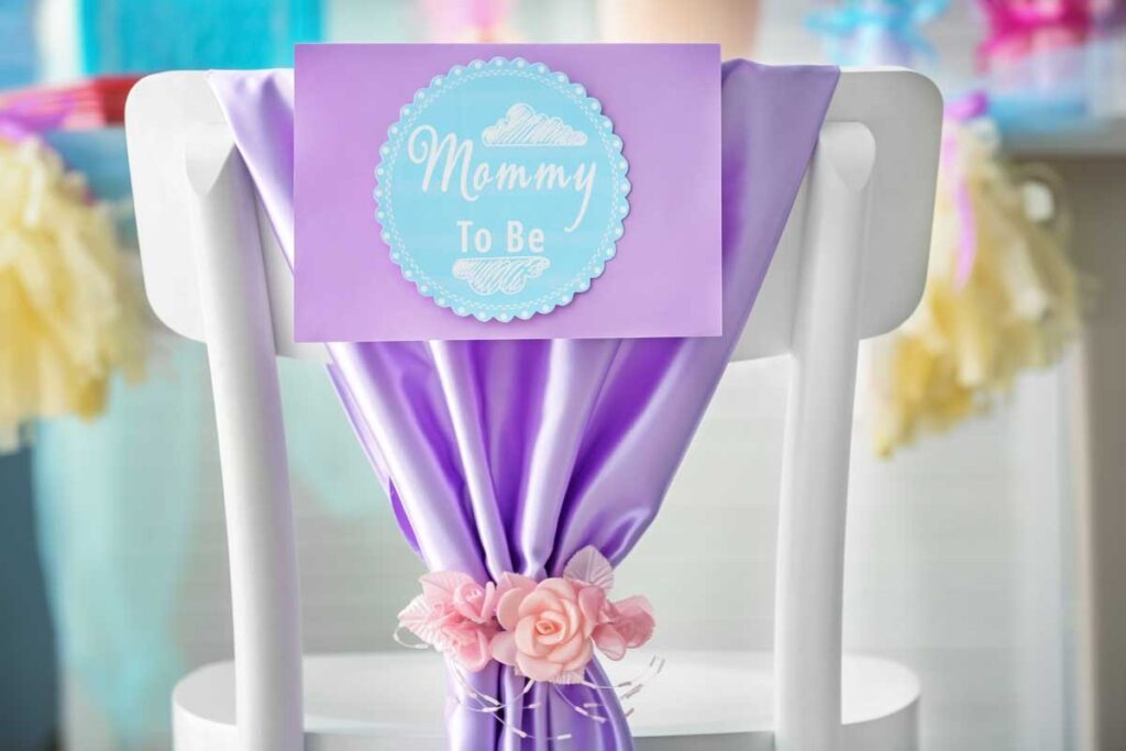 a "Mommy to Be" chair decoration for travel theme baby shower