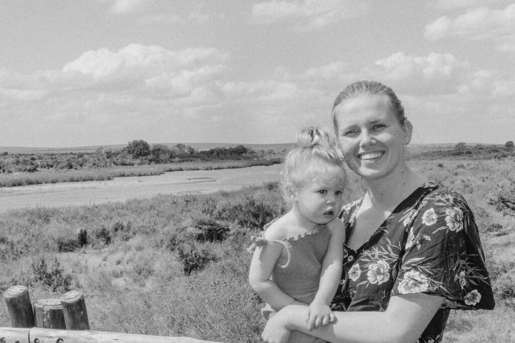 Mother holding baby in South Africa on safari in Kruger National Park