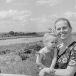 Mother holding baby in South Africa on safari in Kruger National Park