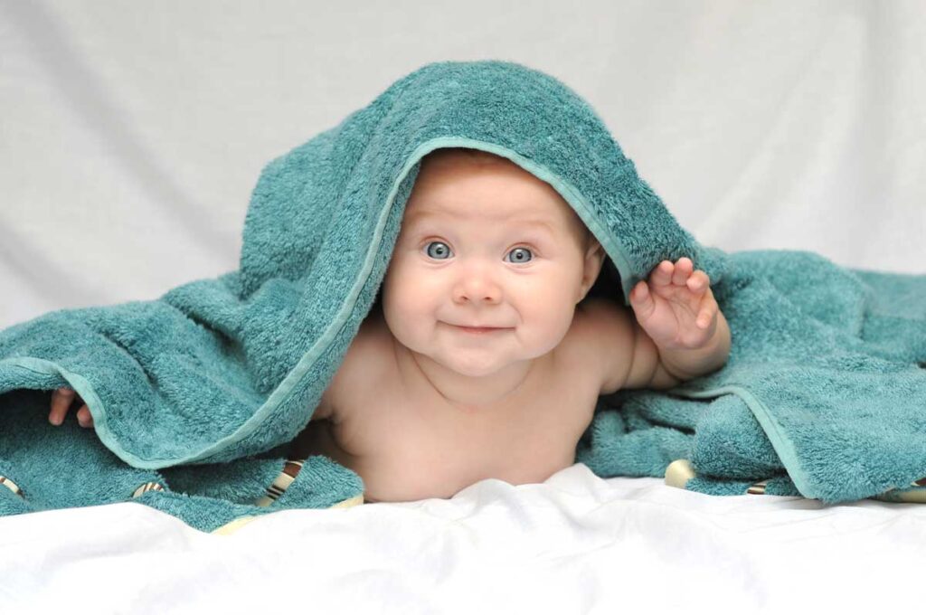 Baby-under-a-green-towel