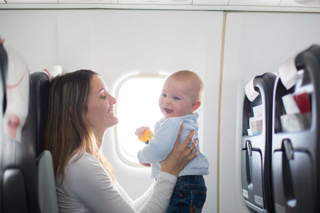 mother flying with lap infant