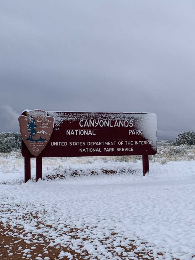 Canyonlands National Park sign with snow