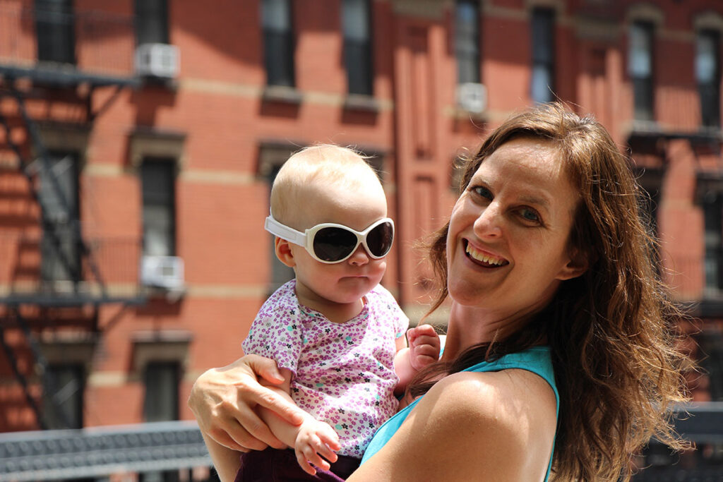 Celine Brewer - owner of Baby Can Travel, with her baby daughter in New York City.