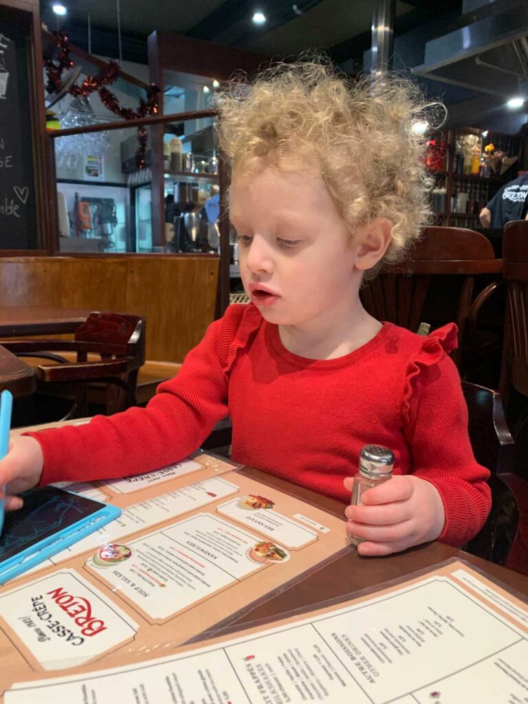 toddler eating at restaurant in Quebec City