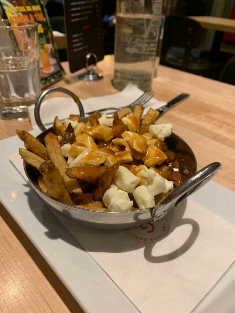 eating Poutine in Quebec City with toddler