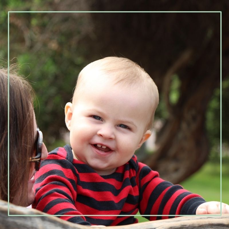 baby smiling at camera