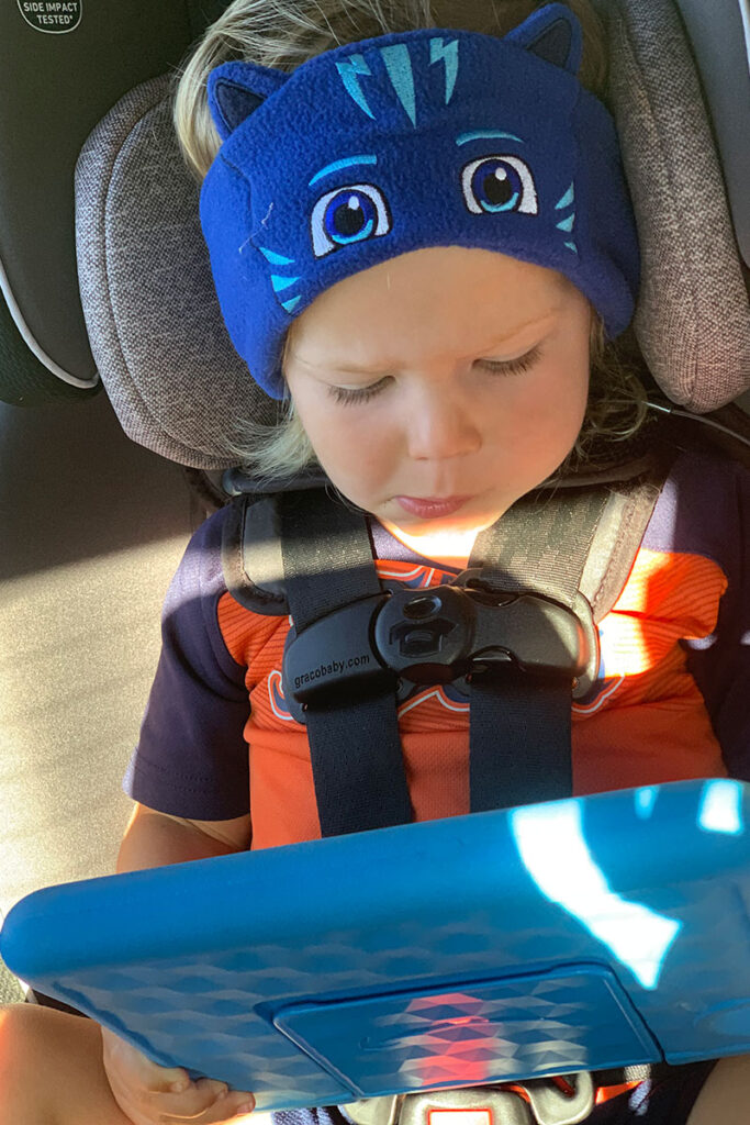 a child wears a CozyPhones Headband - one of the best toddler headphones.