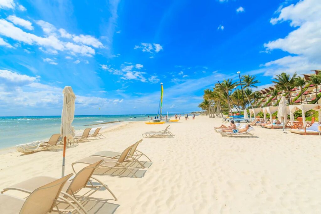 a stunning white sand beach on the Caribbean Sea at the family-friendly Grand Velas Riviera Maya resort.