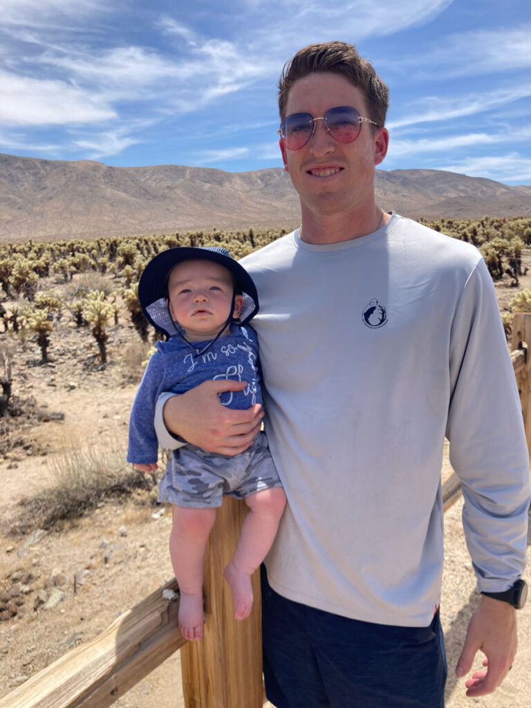 father holding baby on hike - Joshua Tree with a Baby