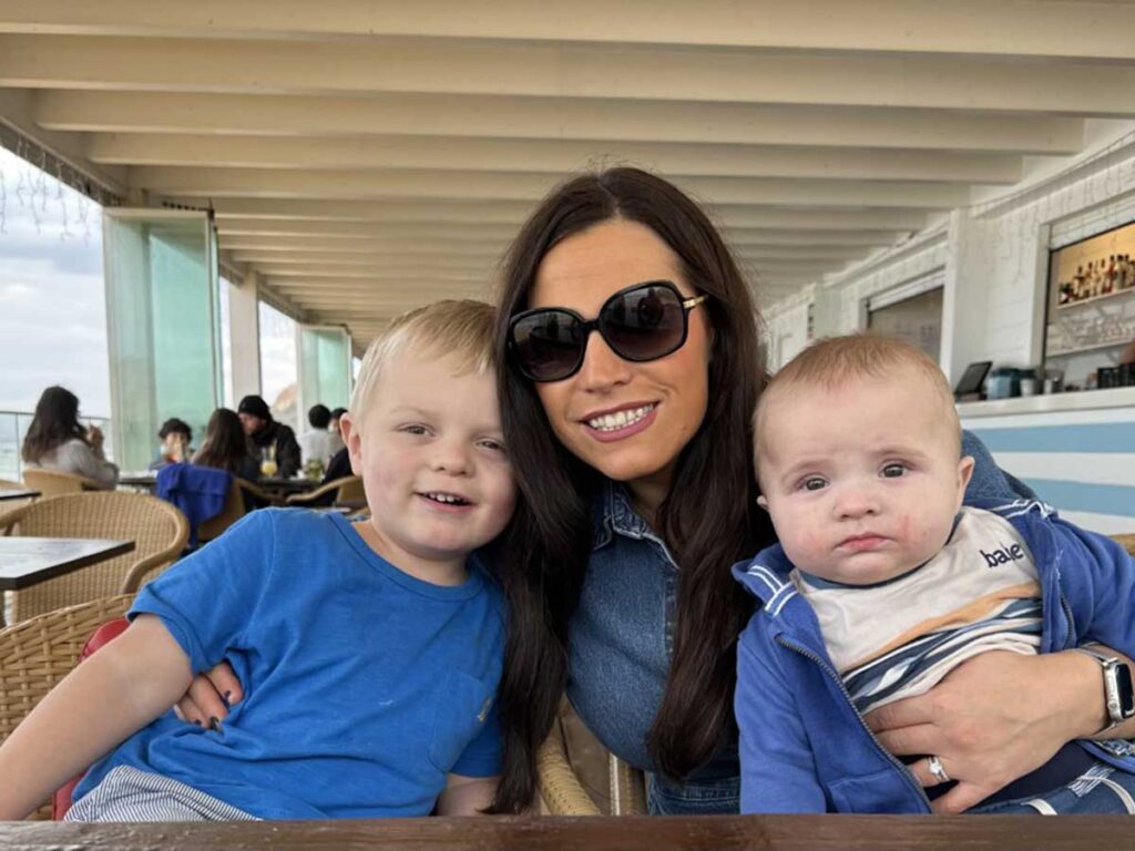 Mother traveling with baby and toddler.